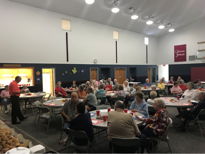 One of our senior dinners with Pastor Mike welcoming our visitors. We usually averaged 50 people at these meals. This has been well received in the community.